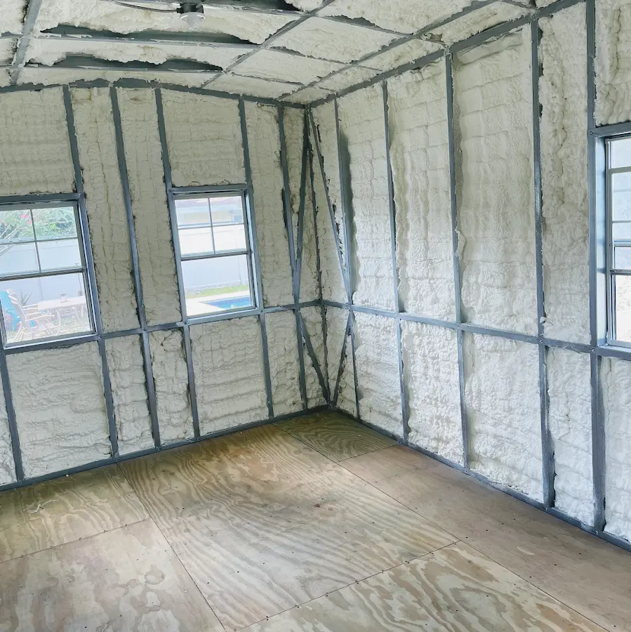 Closed-cell spray foam insulation applied to wall cavities in a residential project in Granger